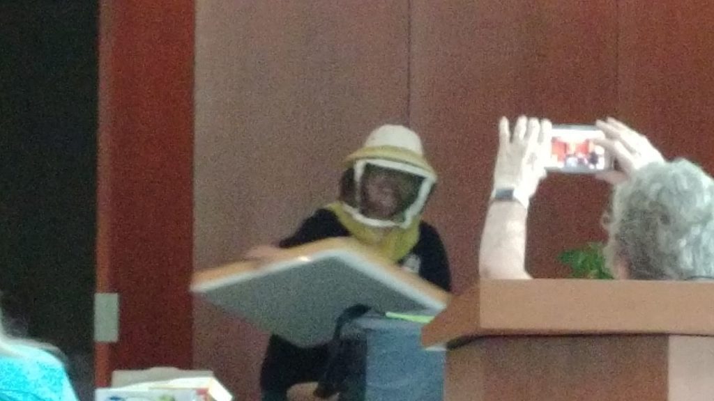 Marcia in her beekeeping outfit.