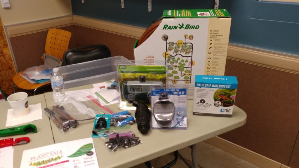 Table of items Carolyn brought to demo drip irrigation