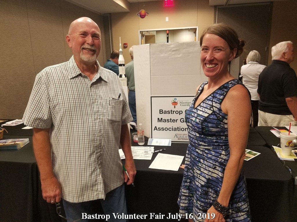 Kerry with visitor Gary at Bastrop Volunteer Fair July 16, 2019
