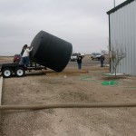 Installing the rainwater harvest tank at the 4-H Building.