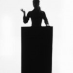 Person Standing at Podium