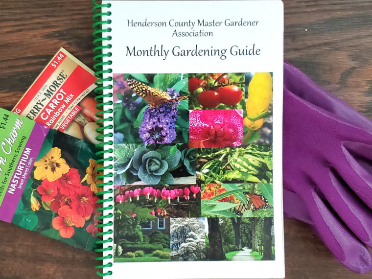 HCMGA Monthly Gardening Guide with 2 seed packets and purple gloves